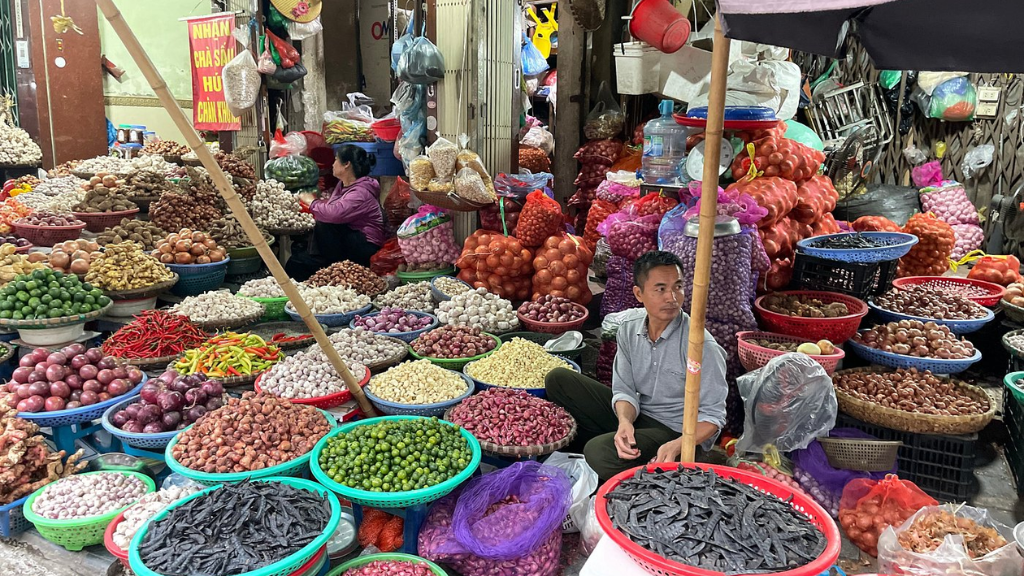 Vietnamese wet market with fresh herbs and produce