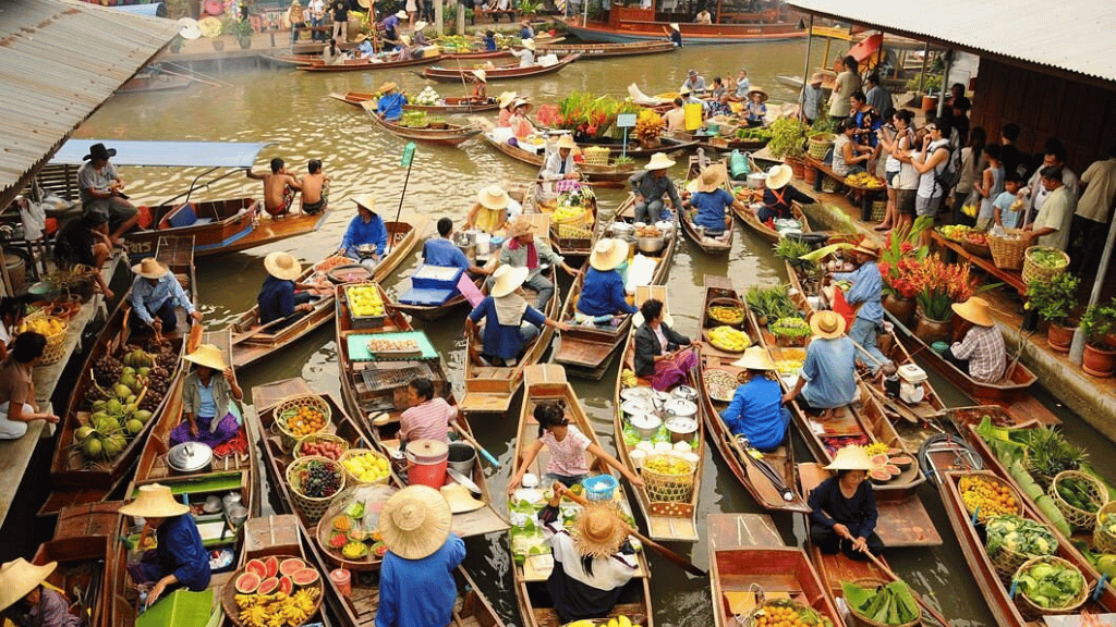Traditional wooden boats selling goods at Damnoen Saduak Floating Market
