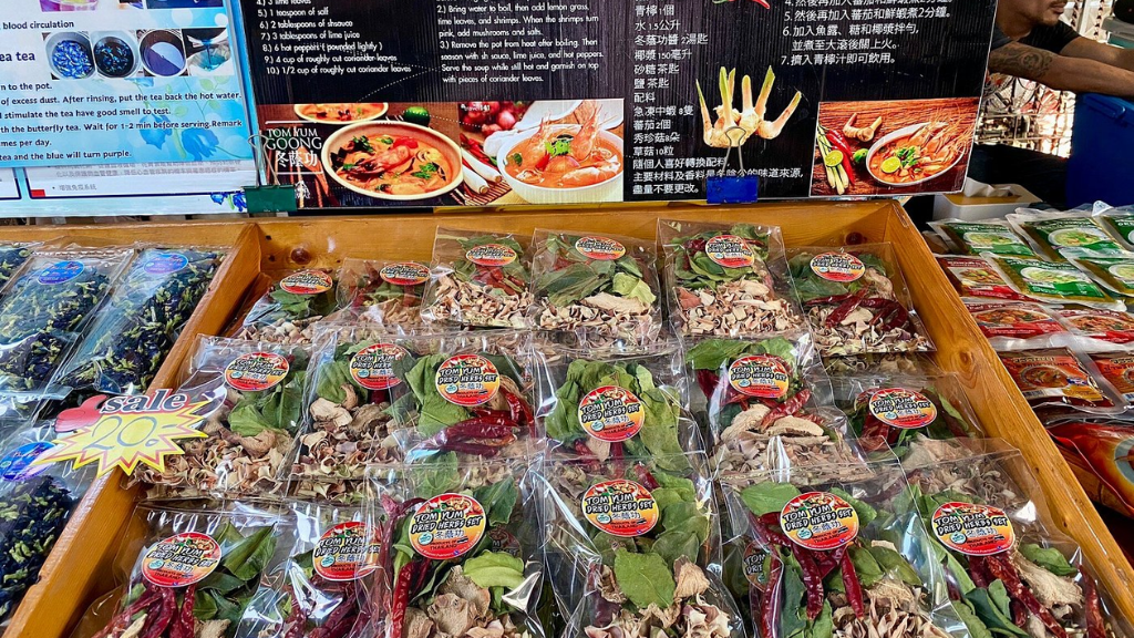Visitors enjoying local food Mae Khlong Market