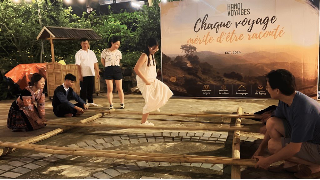 Hanoi Voyages team participating in traditional bamboo dance with Pa Co villagers