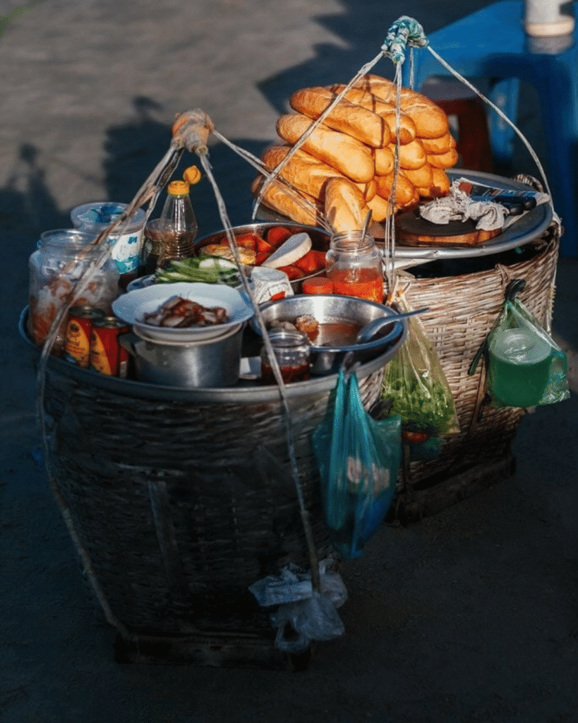Banh mi street vendor in Hanoi serving quick local breakfast