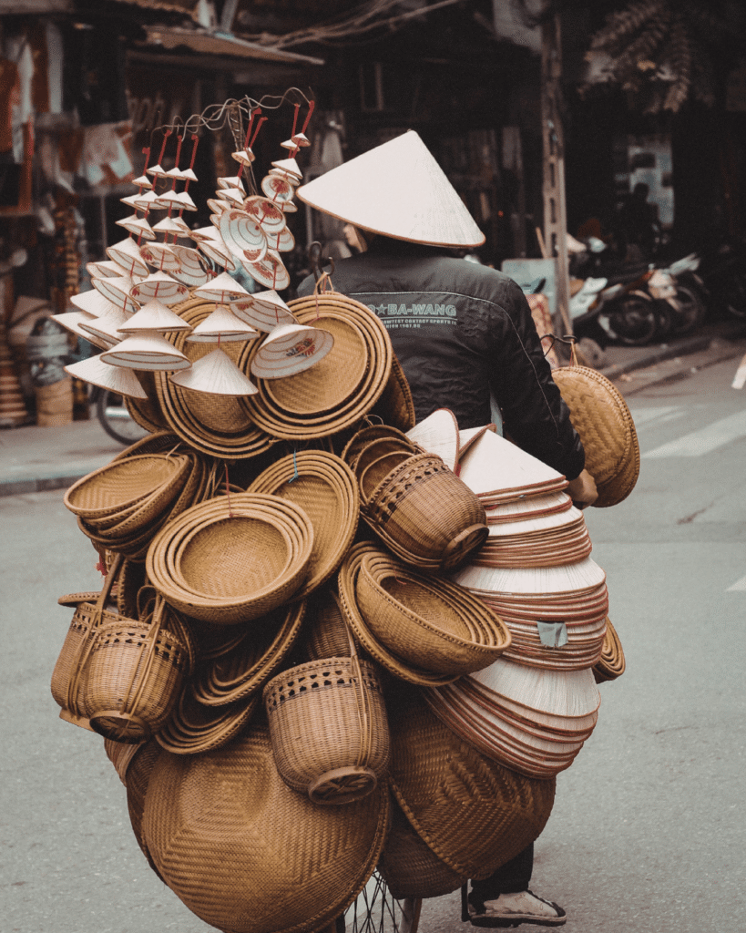 Street scene in Hanoi with vendors selling household items