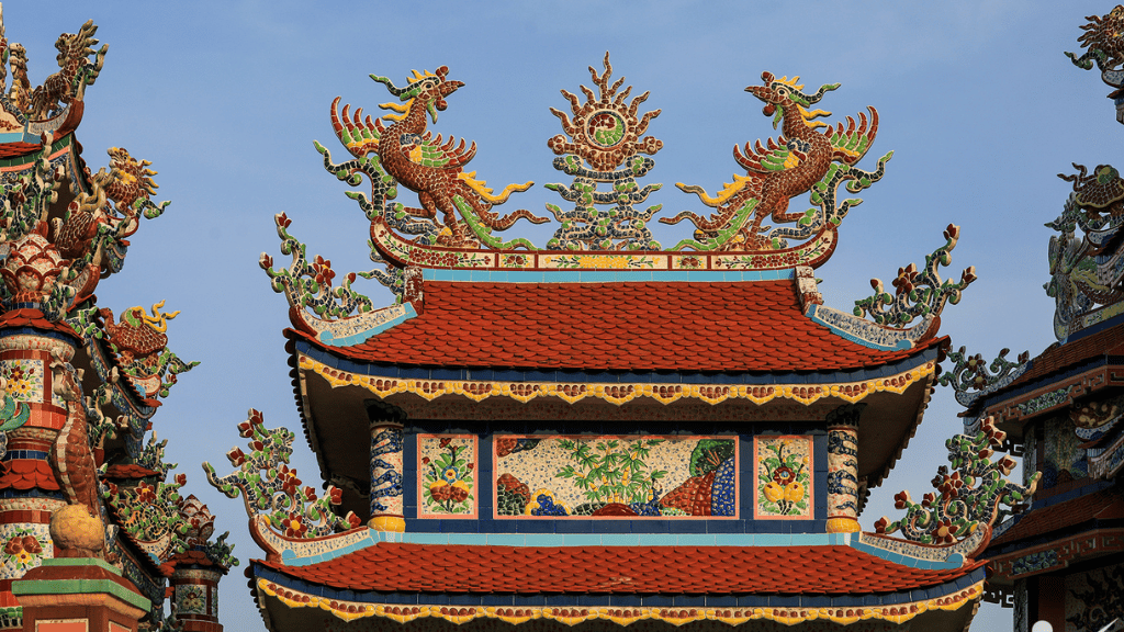 Intricate patterns carefully carved and detailed on a tomb at An Bang Cemetery