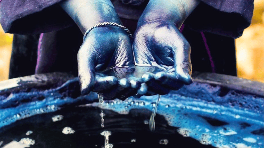 Hmong artisans&rsquo; hands shaping the traditional indigo dyeing process
