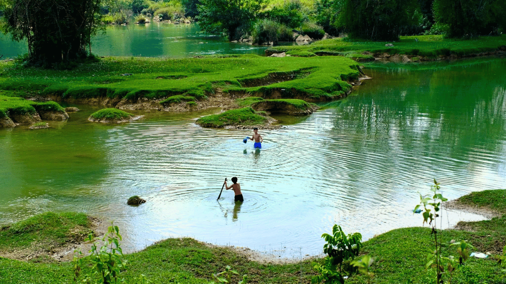 Local people going about their daily lives in Ngoc Con Valley